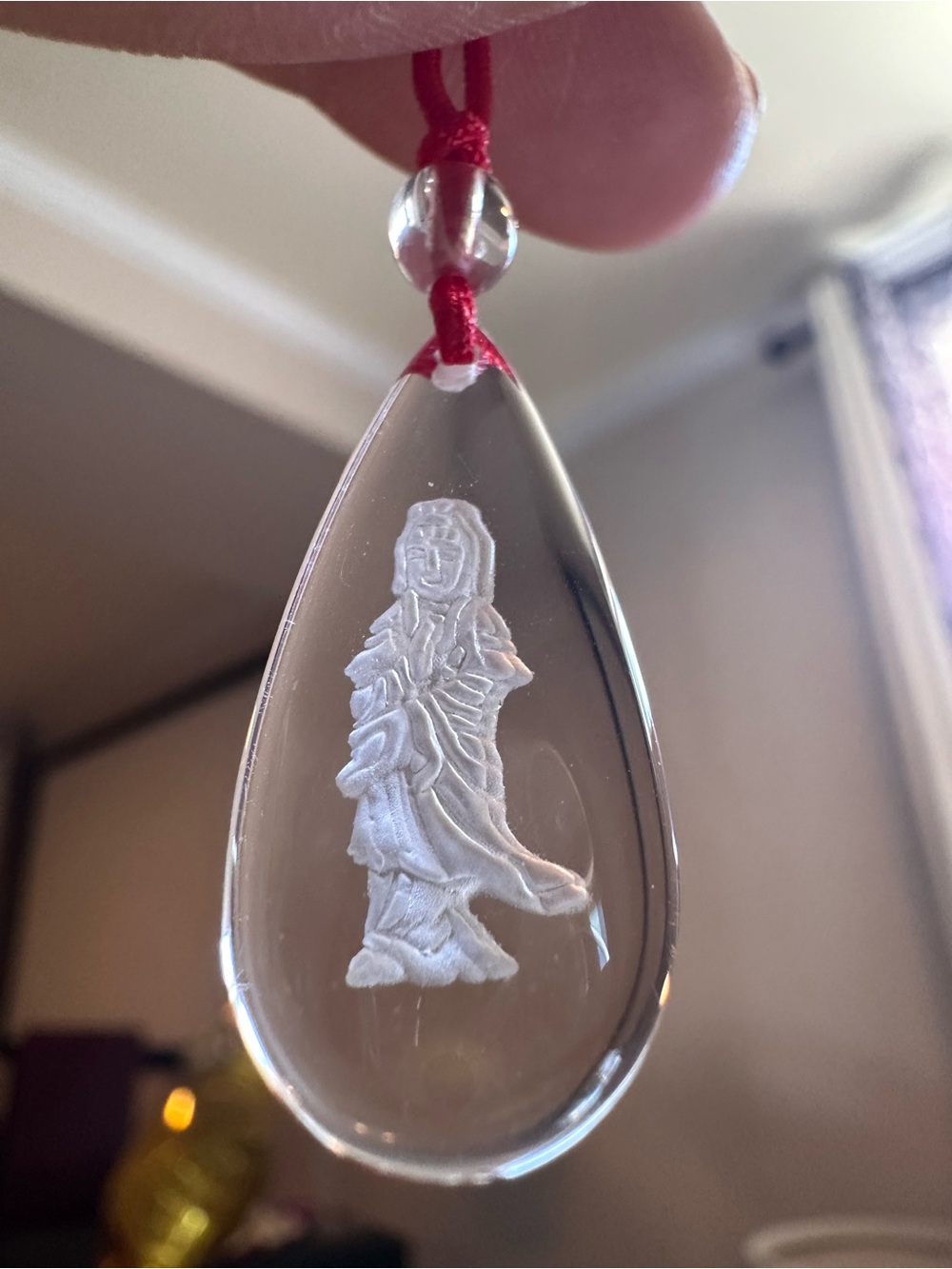 Crystal Teardrop Pendant Necklace with White Carved Figure - Red Cord